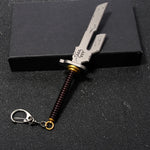 Metal keychain sword with a spring on a black background
